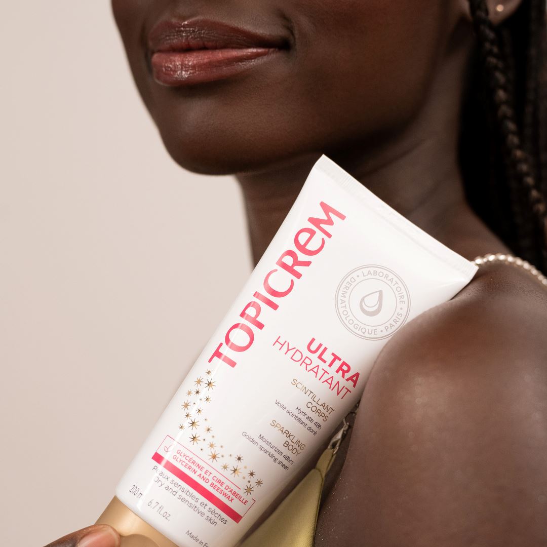 ტოპიკრემი - დამატენიანებელი ტანის რძე ოქროსფერი ბზინვარების ეფექტით